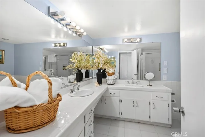 Dual vanity in the bathroom, with lots of lighting.