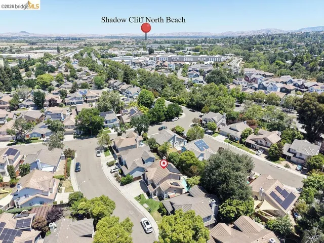Aerial perspective of a residential neighborhood featuring numerous detached homes with varied architectural styles
