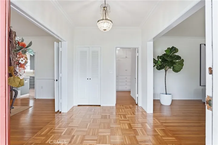 Front entry with wood Parque floors and entries to main areas.
