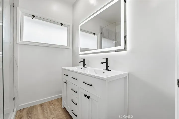 South side 3/4 bath with dual sinks.