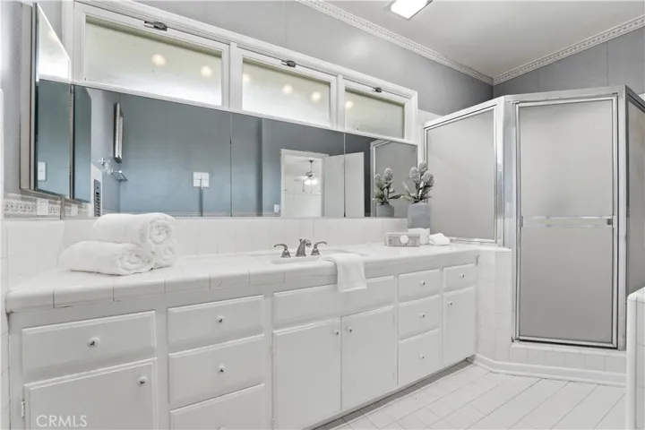 View of primary bathroom from back of room.