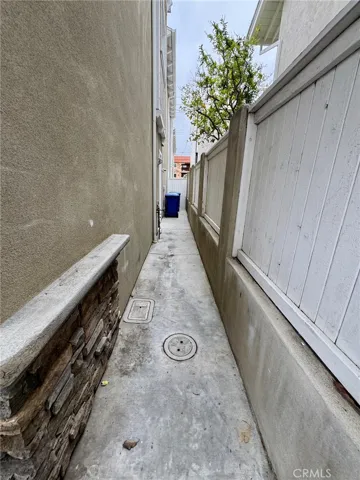 Side yard with door to garage