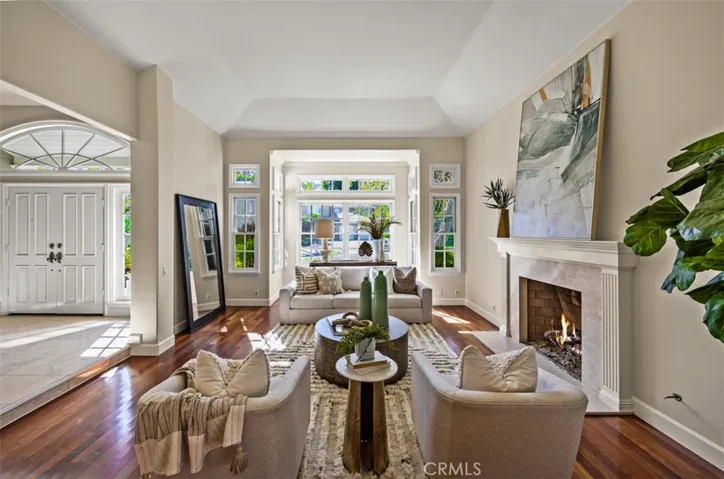 Spacious formal living room with wood burning fireplace