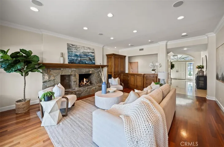 Family room with raised hearth wood burning fireplace