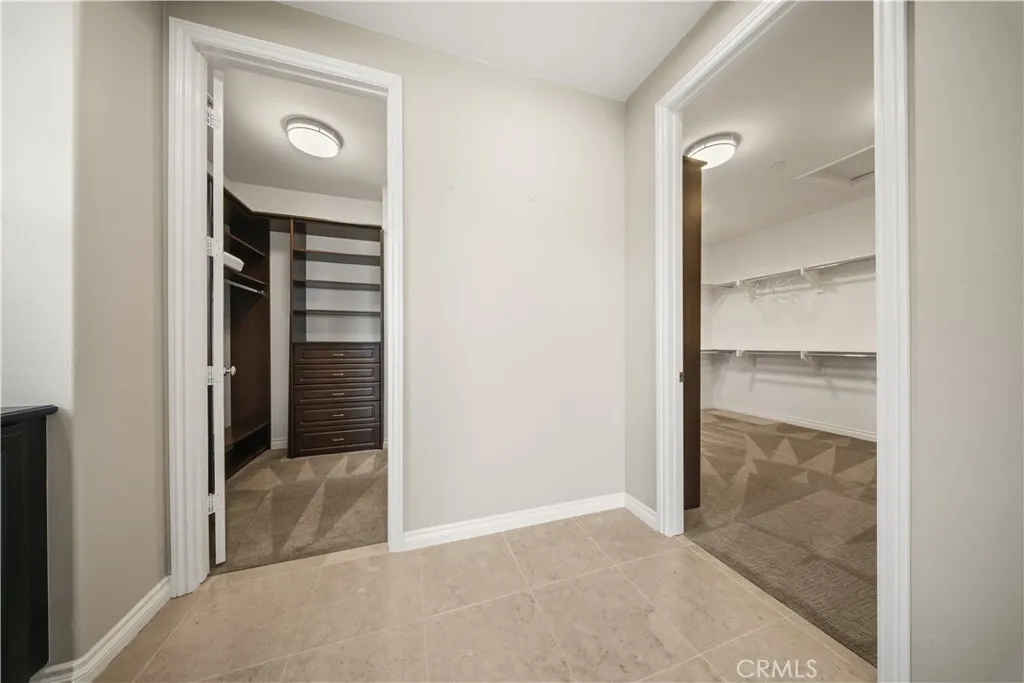 Dual entrance to the wrap around primary closet.