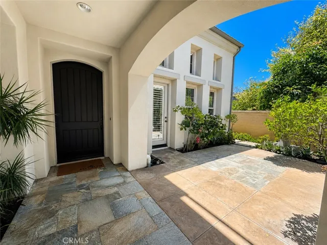 Gated courtyard leads to detached casita.
