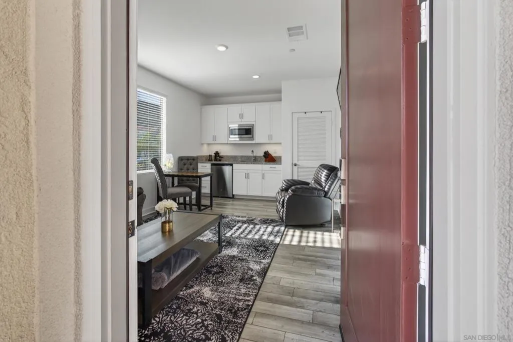 Exterior door at front porch into private ADU entry