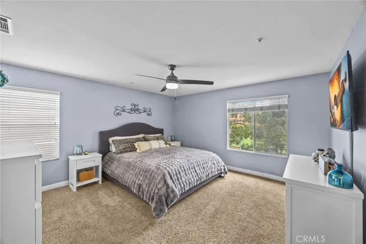 Spacious primary with hills and golf course view.