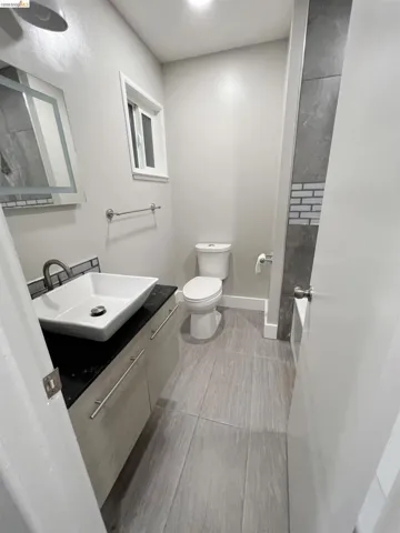 Bathroom featuring vanity and toilet