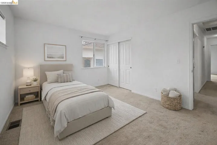 Bedroom with carpet floors and a closet