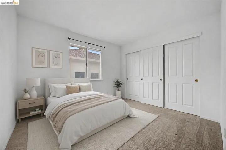 Bedroom with carpet and a closet