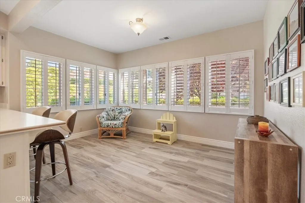 Family Room adjacent to the kitchen with breakfast bar.