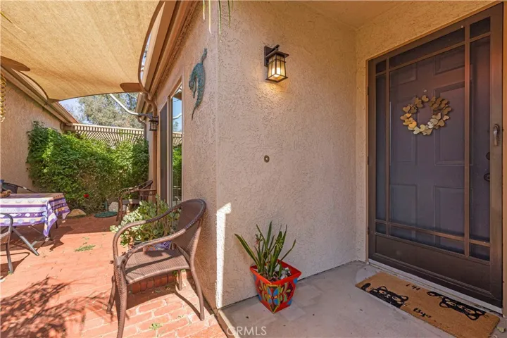 Patio is between garage and home