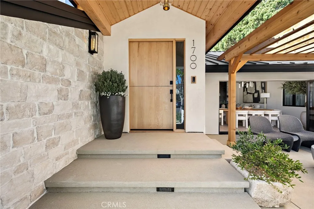 Large oak custom dutch door with a custom oak covered entry