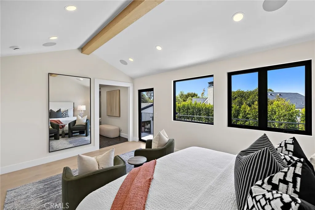 Primary bedroom with large elevated on-suite bathroom and walk-in closet