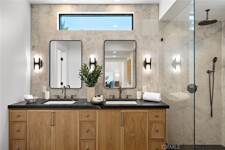 Double oak vanity with fluted marble backsplash