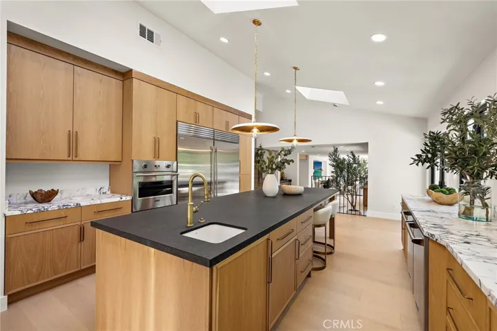 Leathered granite oversized island, and another wall oven