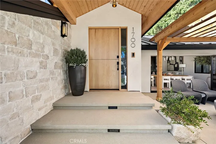 Large oak custom dutch door with a custom oak covered entry