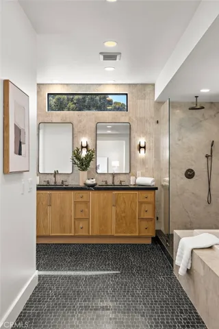 Primary on-suite bath with designer tile flooring