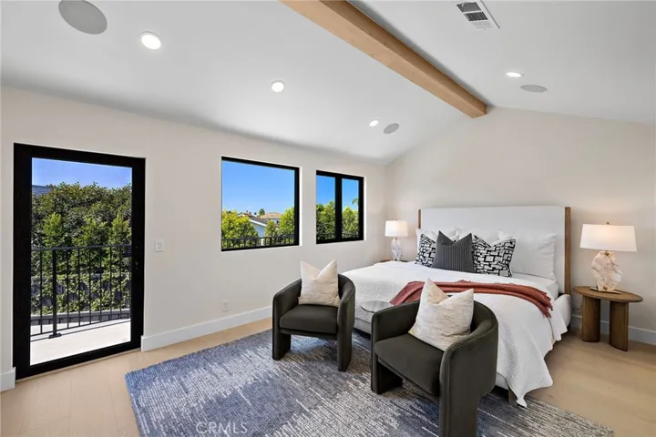 Primary bedroom with private balcony with mountain views