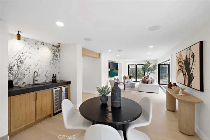 Dining area, marble bar area and TV room with 100 inch TV