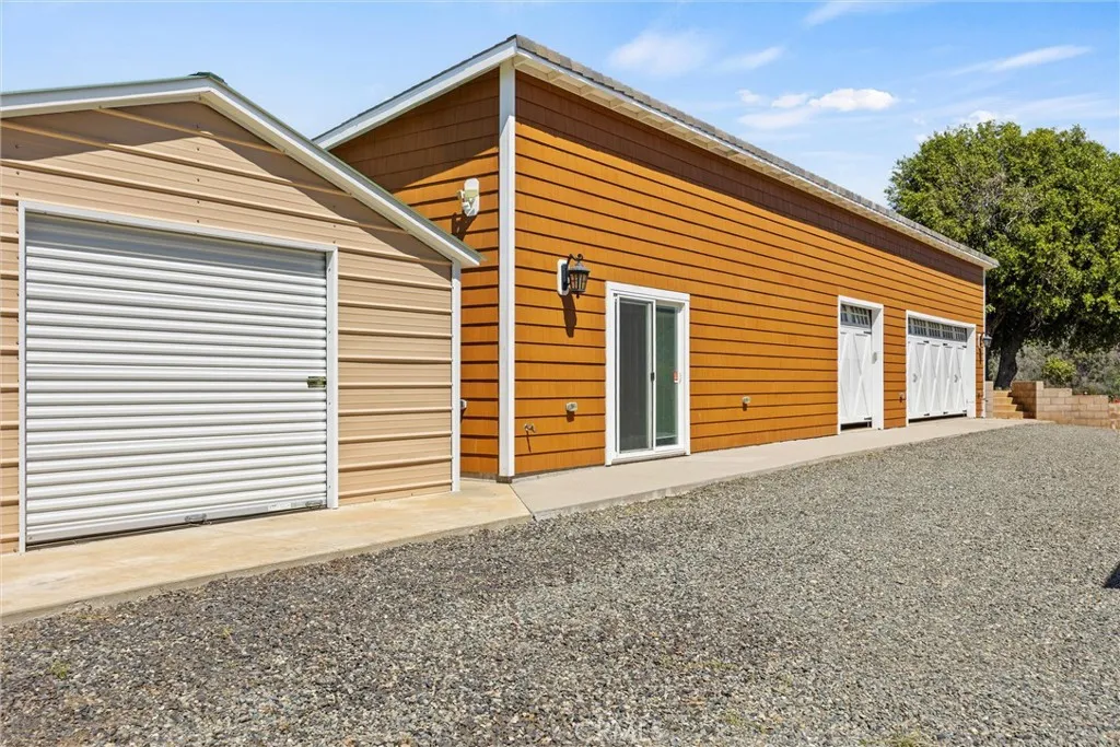 Wood Shed, Gym, & 3 Car Garage with Workshop