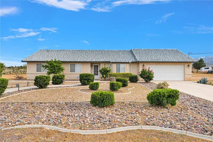 Home Front with concrete walkway and concrete driveway