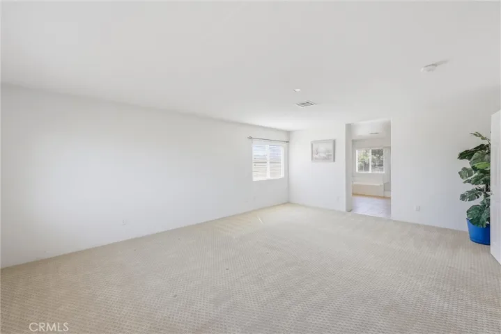 Open an airy primary bedroom