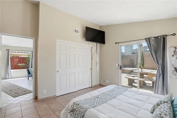 PRIMARY BEDROOM OPENS TO PATIO