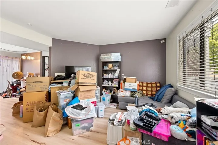 Living room, fireplace hidden behind belongings.
