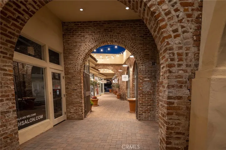 Evenings in San Juan bring a warm, inviting atmosphere, where string lights, brick pathways, and local charm come together.