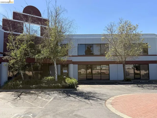 view of property featuring uncovered parking