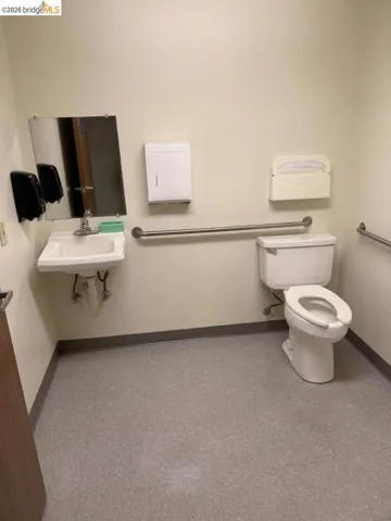 half bathroom featuring toilet