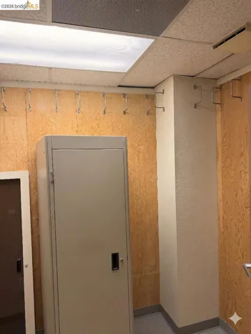 detailed view of a paneled ceiling and baseboards