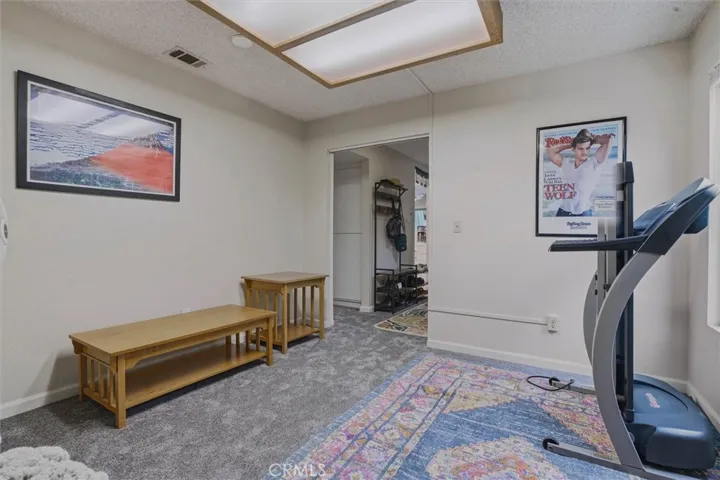 Downstairs bedroom uses as an office/workout space.