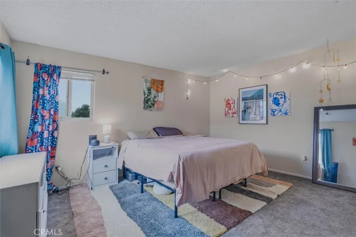 Spacious Primary bedroom with new carpet.