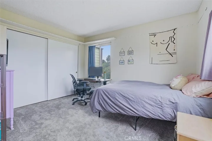 Secondary bedoom upstairs with large closet.