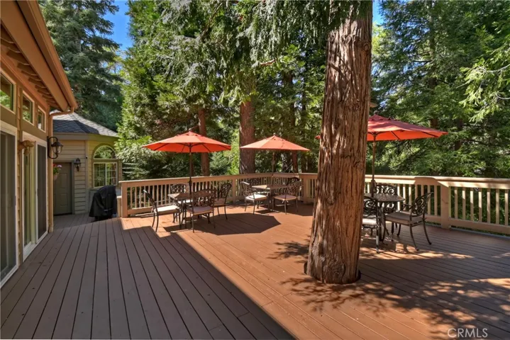 Deck overlooks private natural area below.