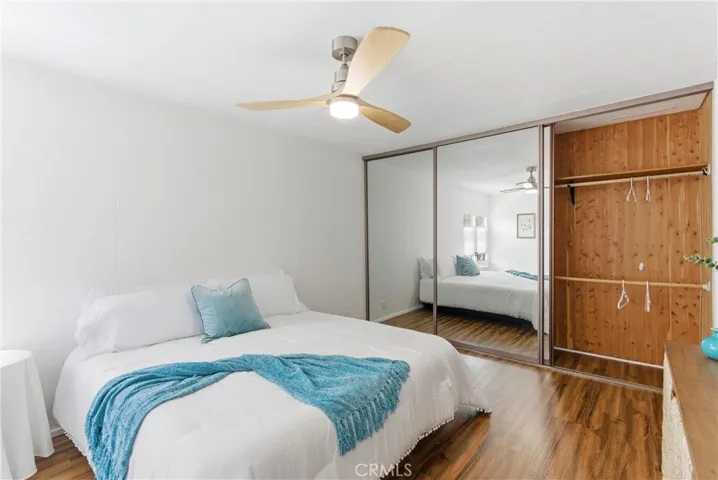 WALL TO WALL MIRRORED CLOSETS WITH CEDAR CLOSETS