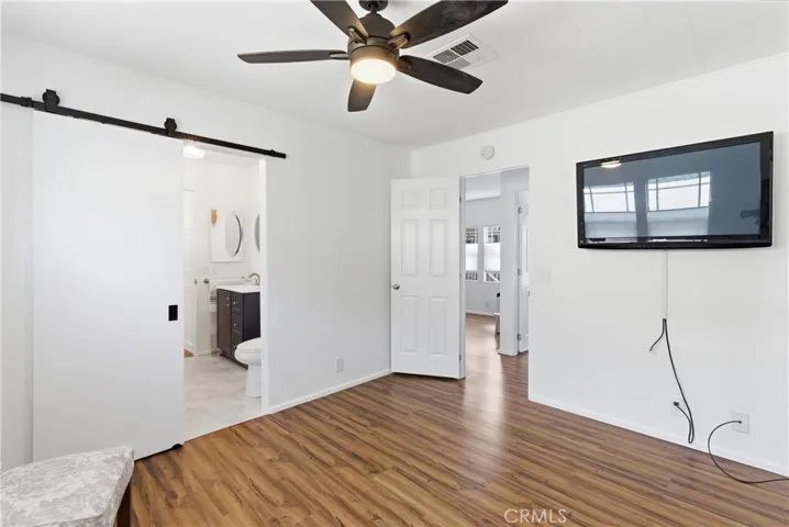 BEDROOM #2 - BARN DOORS LEADING TO GUEST BATHROOM