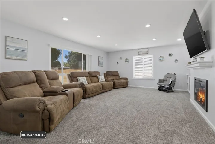 Spacious and Light filled Living Room with Fireplace, Recessed Lighting & Built-Ins