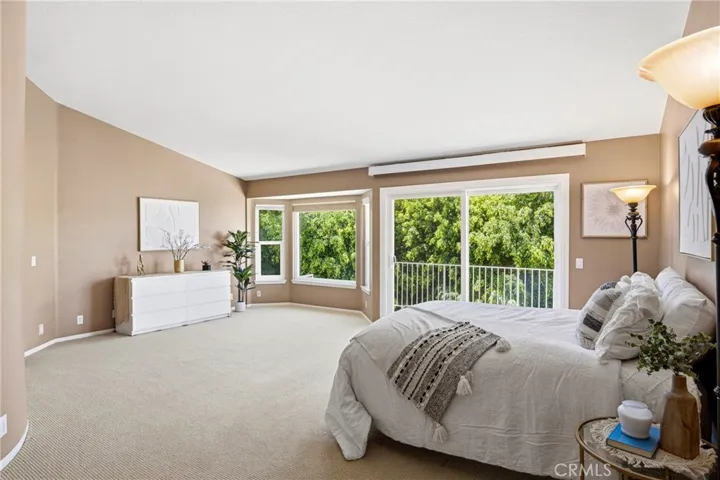Expansive Primary 1 with Balcony overlooking backyard
