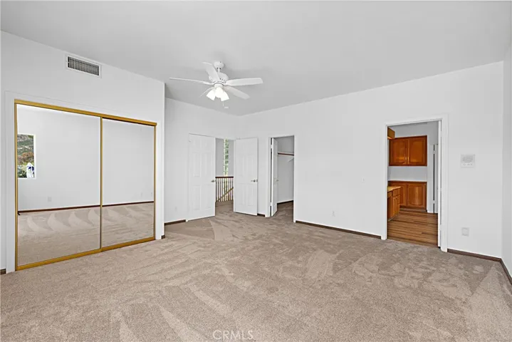 Master bedroom sliding glass door closet.