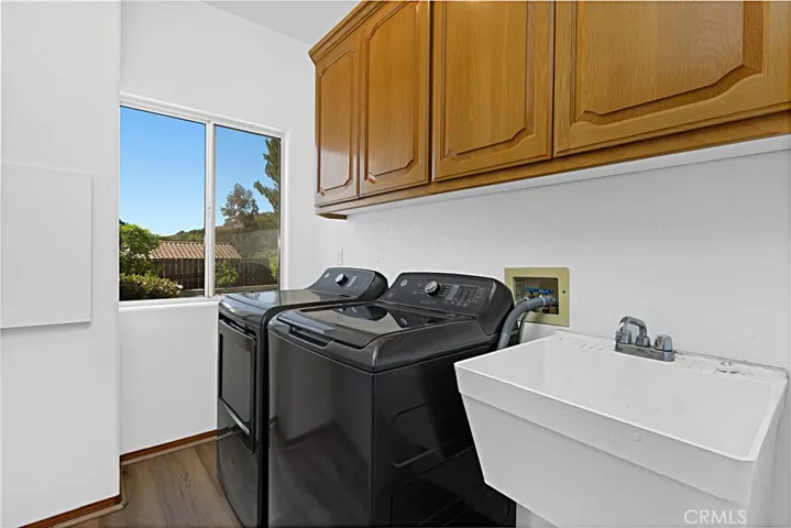 Laundry room with washer and dryer included.
