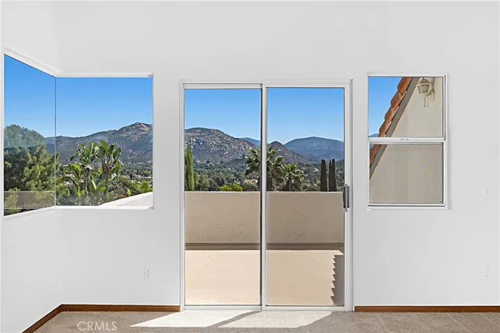 Master bedroom has sliding glass door to the balcony.