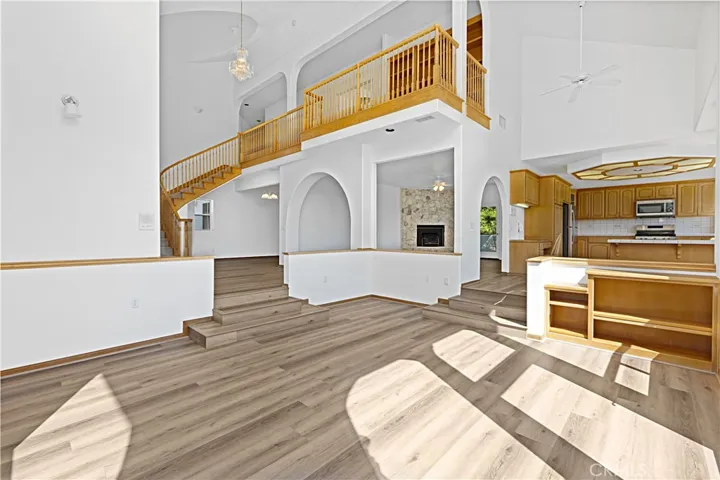 Living room looking toward stairway, formal dining room and entry.