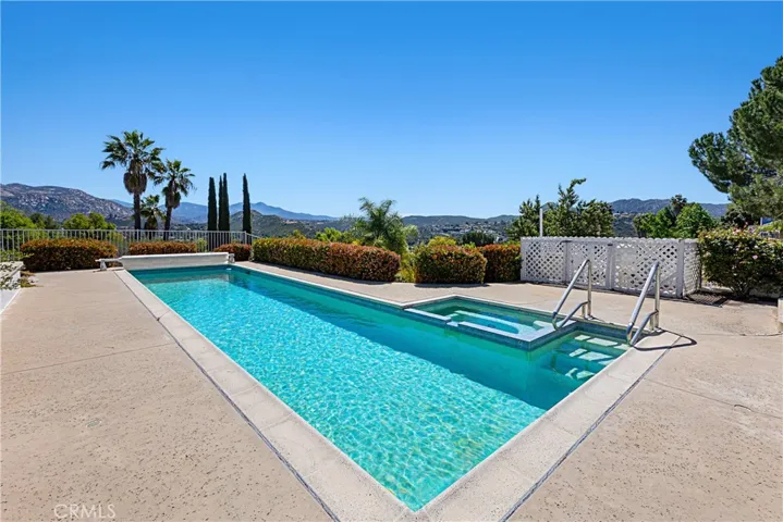Pool deck is very large for entertaining.