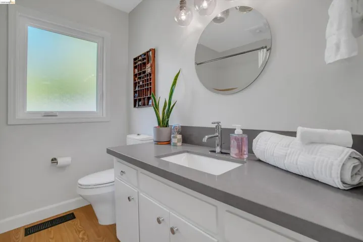 Bathroom with vanity and light wood-style floors