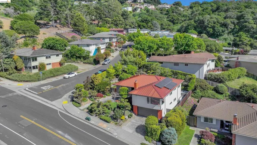 Aerial perspective of suburban area featuring a tree filled landscape