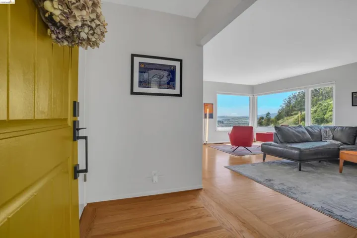 Living room with light wood-style floors and baseboards